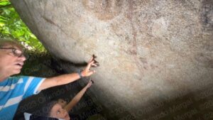 David Velázquez showing us the petroglyphs | Las Piedras, Puerto Rico | You’ll Be Surprised! | Puerto Rico By GPS